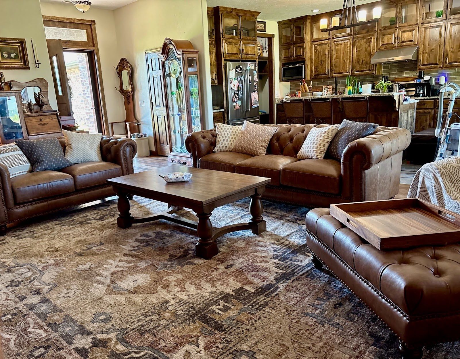 Customer living room with leather sofas and a large wood coffee table