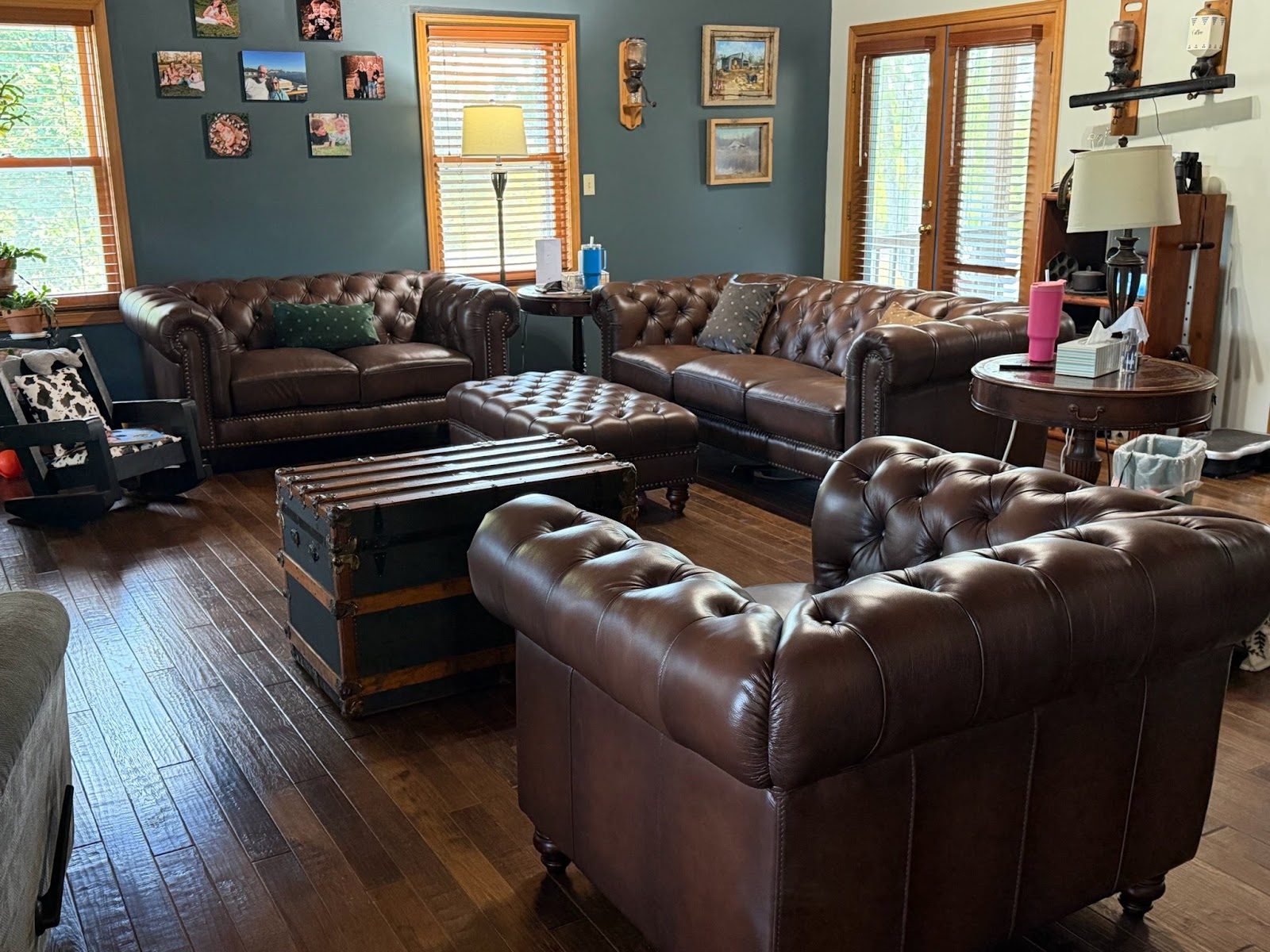 Customer room with tufted leather Chesterfield sofa and chair
