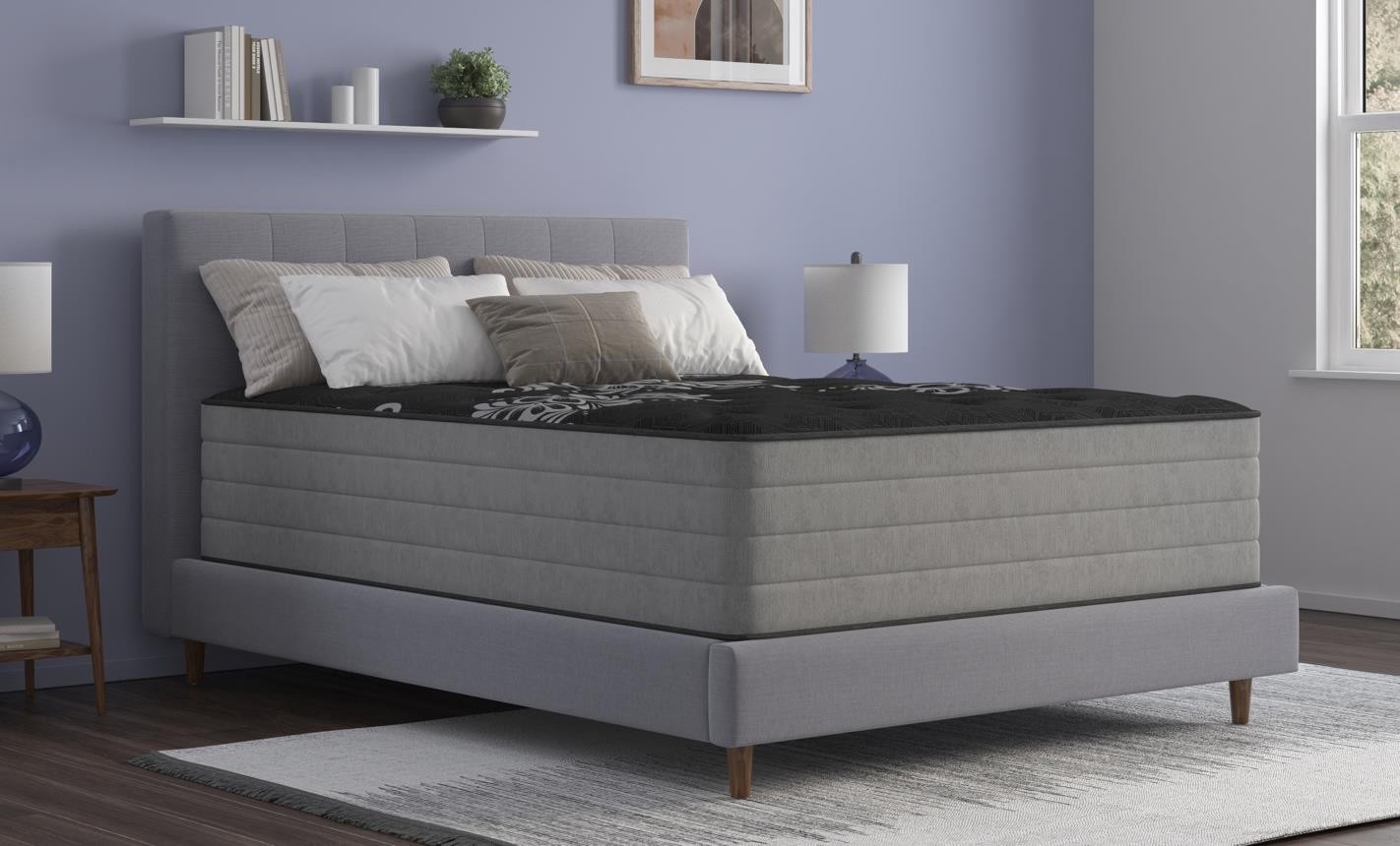 MD Mattress TRU mattress on an upholstered bed in a staged bedroom